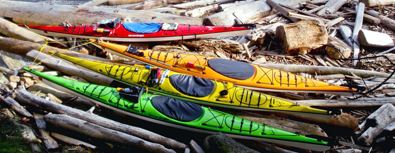 Current Design kayaks in driftwood on Vancouver Island